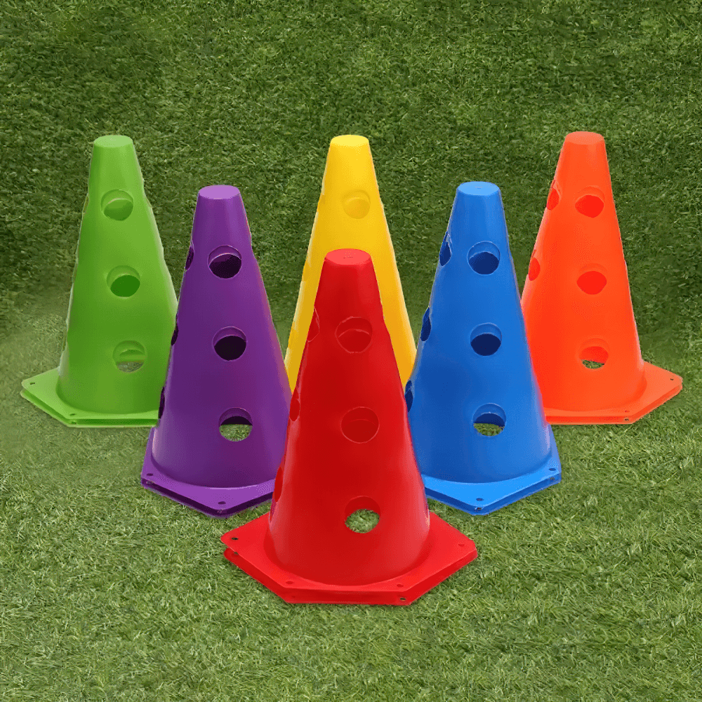 Colorful set of 6 sports marker cones with holes for agility training on grass surface.