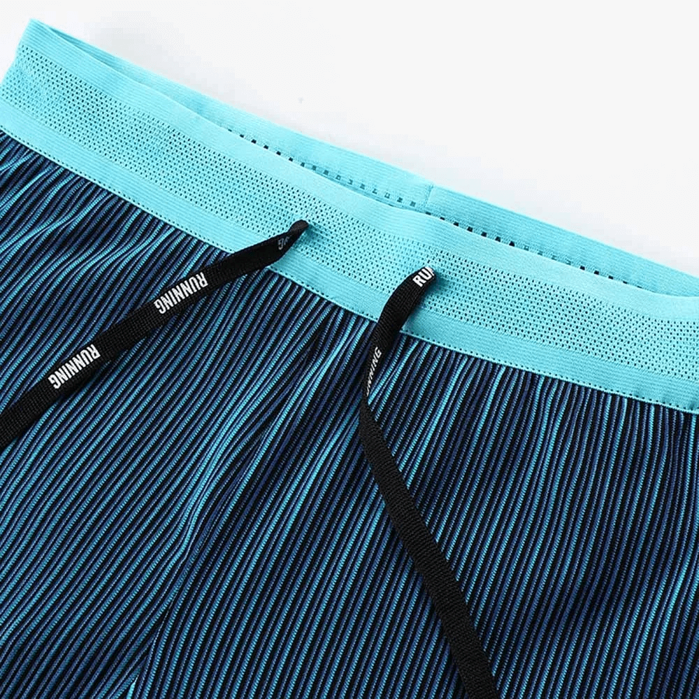 Close-up of SF1860 men's compression running shorts with drawstring and striped pattern.