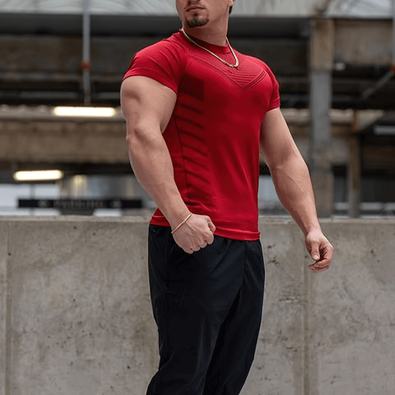 Model wearing red sports men's quick dry t-shirt, ideal for workouts, featuring short sleeves and o-neck, perfect gym attire SF1324.