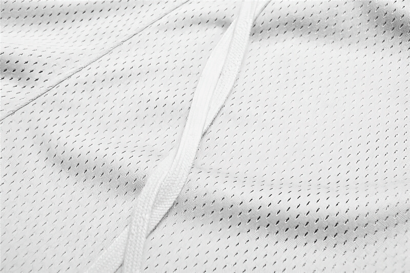Close-up of breathable polyester mesh fabric in white, showcasing texture and detail for men's sports mesh short shorts with pockets.