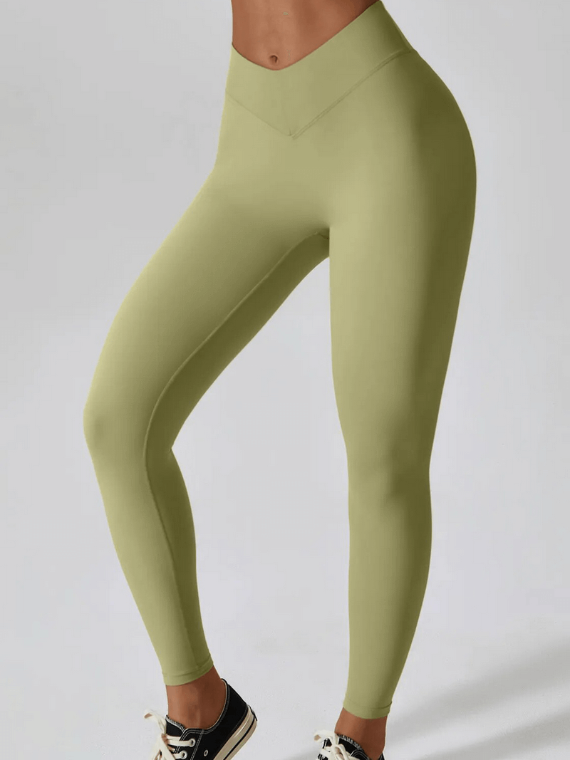 Sporty olive green leggings with a slim fit, perfect for comfortable exercise, made of lightweight, breathable fabric.