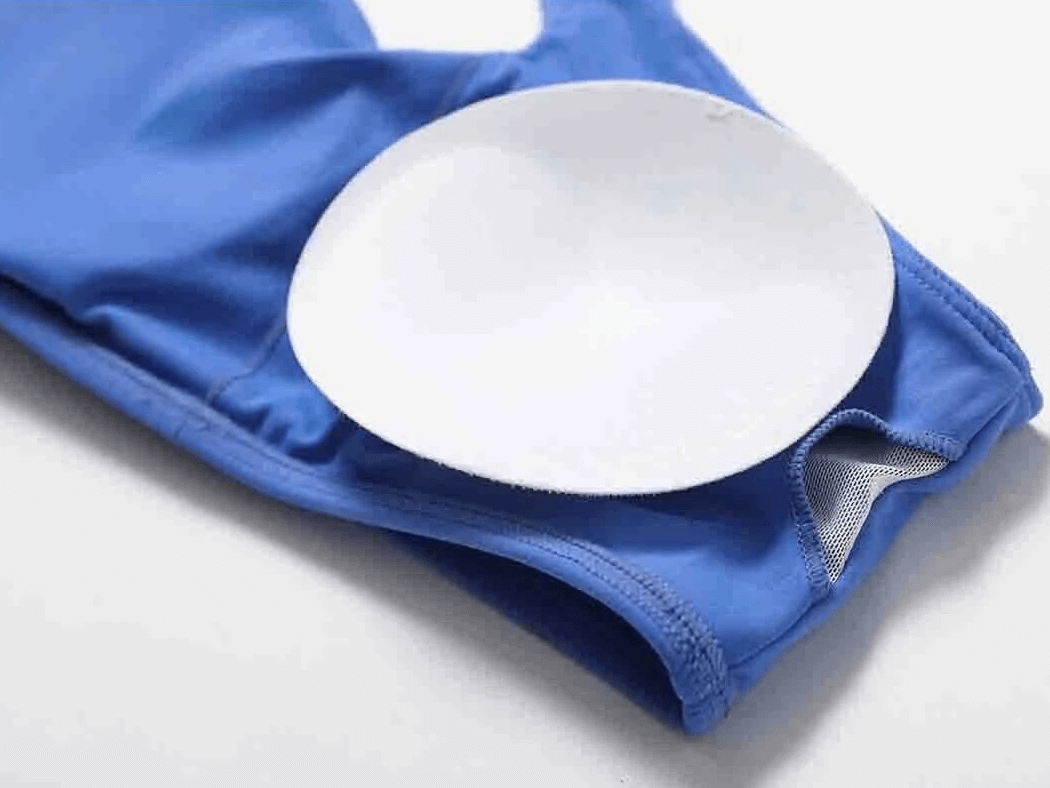 Close-up view of blue Sports One Shoulder Push-up Bra, showcasing breathable fabric and padding detail.