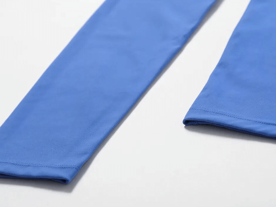 Detail view of blue leggings fabric from Sports One Shoulder Push-up Bra and Leggings Set, showcasing breathable nylon material.