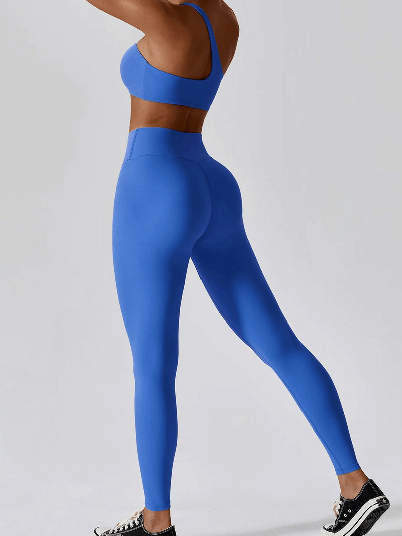 Blue one shoulder push-up bra and leggings set for women, perfect for workouts with breathable, lightweight nylon fabric.