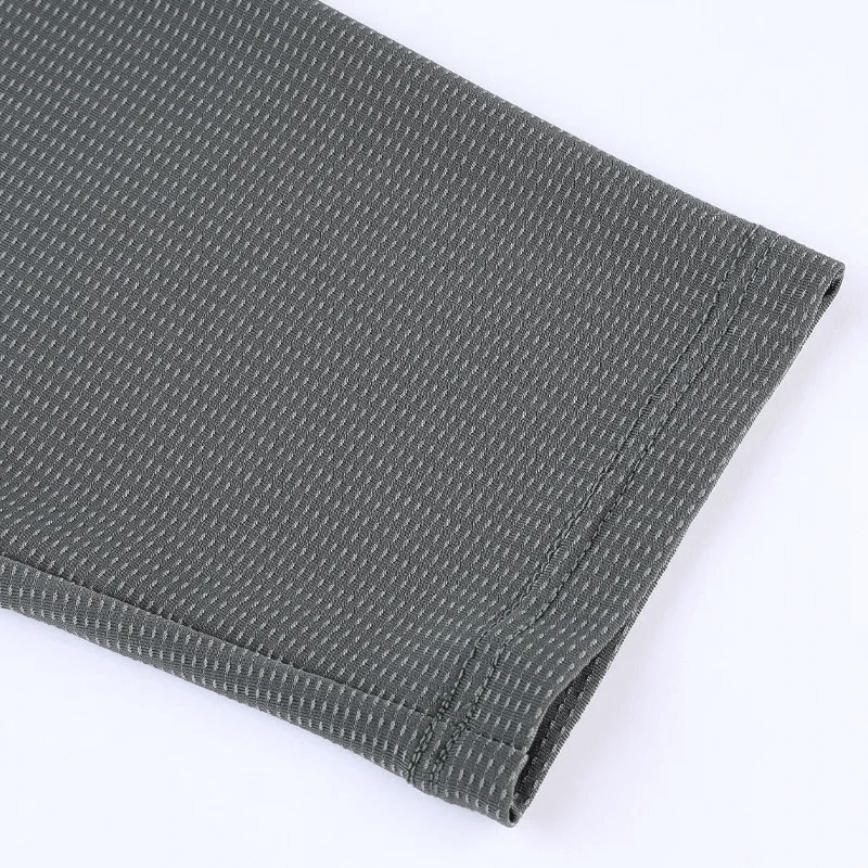 Close-up of grey quick-drying men's pullover sleeve, highlighting detailed polyester texture and quality stitching.