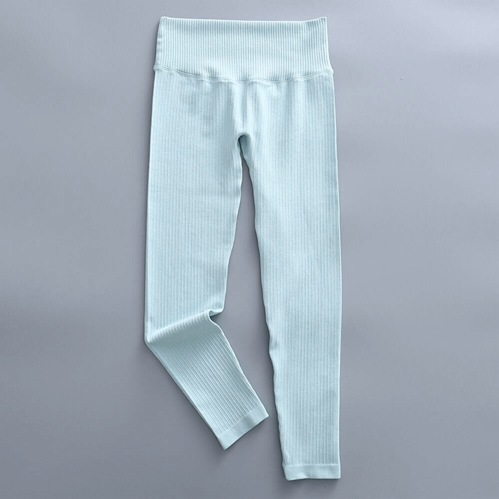 Light blue high-waist ribbed leggings for women, perfect for yoga and sports. Comfortable, seamless design made with nylon and spandex.