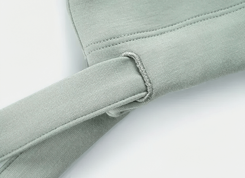 Close-up of the adjustable hem on a sports short sleeves crop T-shirt, showcasing durable fabric ideal for fitness activities.