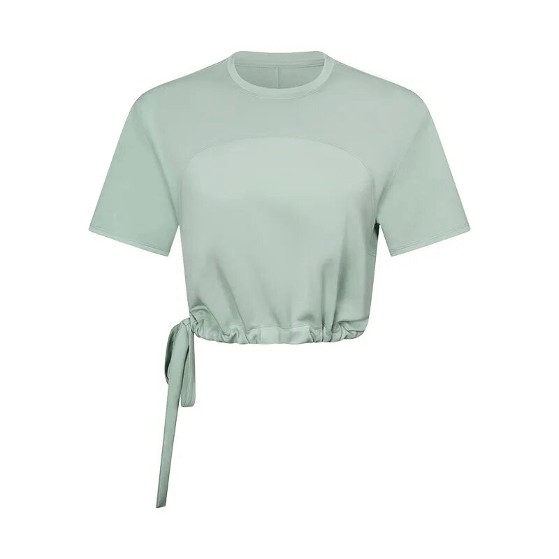 Mint green sports crop T-shirt with adjustable hem for fitness and yoga, made of breathable anti-wrinkle fabric. Perfect for active women.