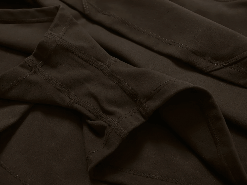 Close-up of brown fabric detail on sports skirt with built-in shorts, perfect for tennis, running, and yoga.