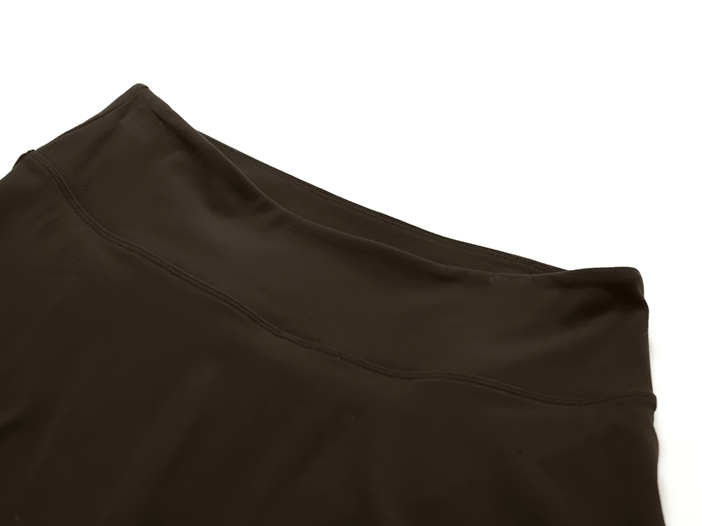 Top view of a stylish black mini sports skirt with built-in shorts, ideal for tennis, running, yoga, and fitness activities.