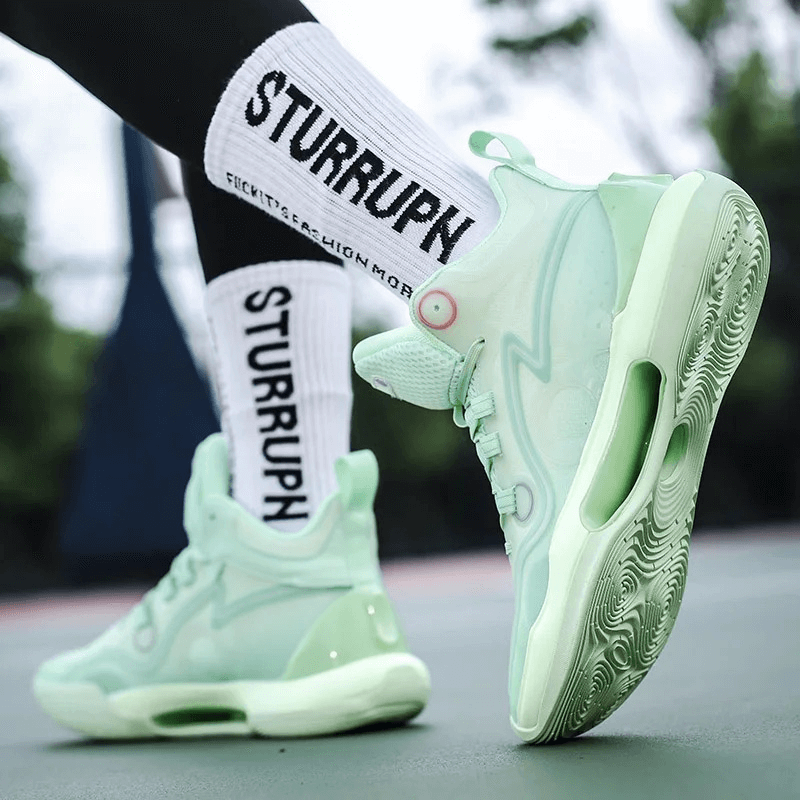 Unisex sports running shoes with reflective elements, lace-up high top design, light green color, shown on outdoor court.