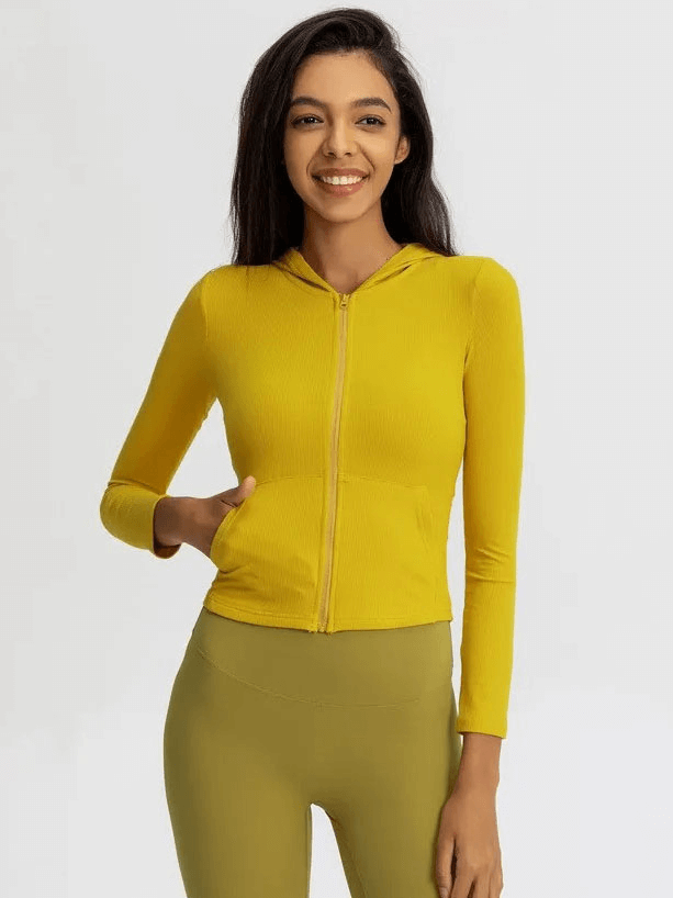 Sporty women's yellow zipper jacket with hood and long sleeves, perfect for outdoor activities and active lifestyles.