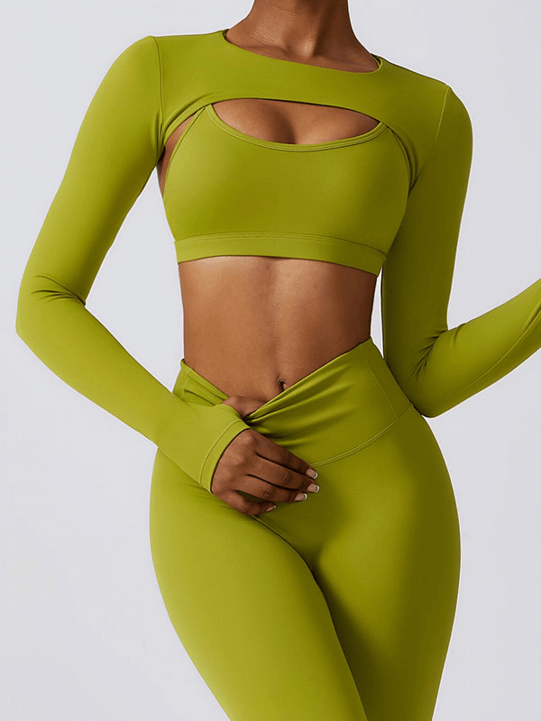Woman wearing a green two-piece yoga set, ideal for fitness activities, featuring quick-dry and comfortable nylon-spandex fabric.