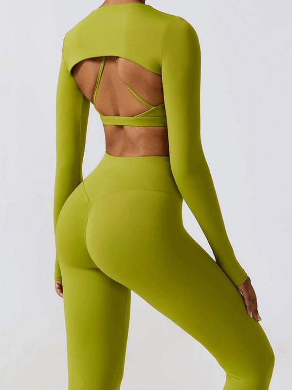 Woman wearing green sportswear yoga set featuring open back design, made for running, fitness, and cycling with quick-dry fabric.