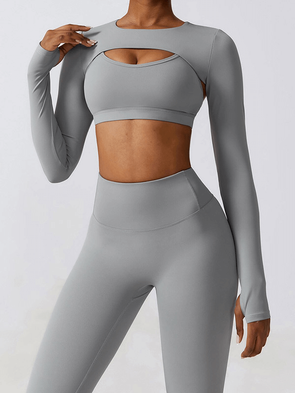 Woman modeling gray sportswear yoga set for women with long sleeves, ideal for fitness, running, hiking, quick-dry fabric.