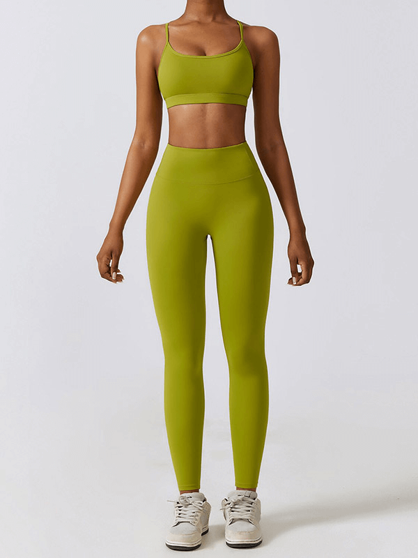 Woman in green sportswear yoga set, ideal for fitness and outdoor activities, showcasing breathable nylon-spandex fabric. Model SF1691.