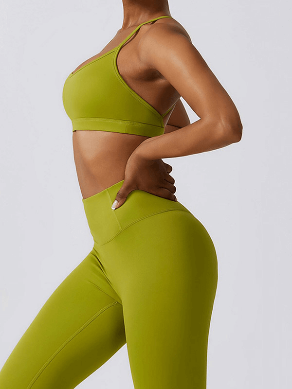 Woman wearing a green sportswear yoga set, designed for comfort and flexibility, perfect for fitness and outdoor activities.