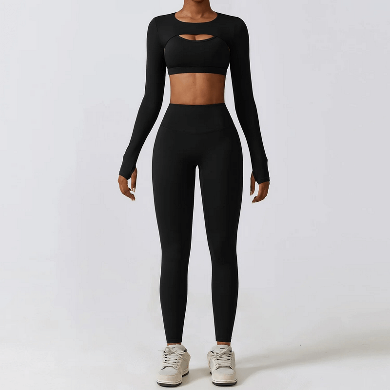 Woman wearing a black 3-piece sportswear yoga set for women, featuring long sleeves and high-waisted leggings, perfect for exercise and comfort.