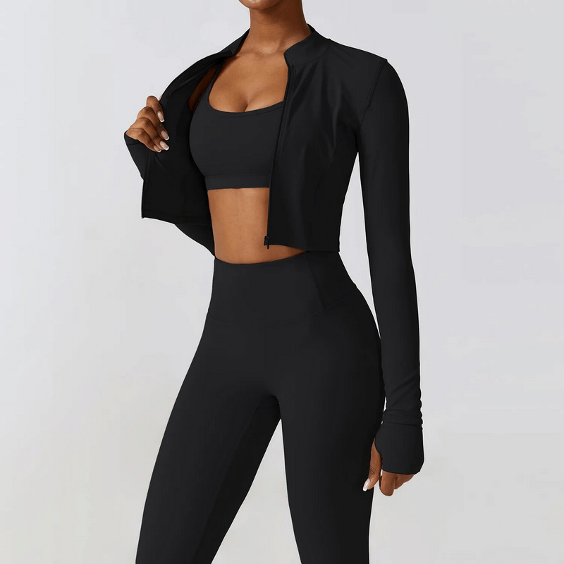 Woman wearing black 3-piece yoga set, featuring a jacket and leggings, perfect for running and fitness with quick-dry technology.