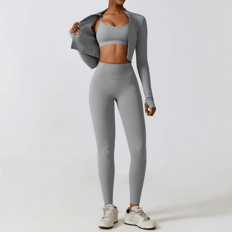 Women's gray fitness yoga set with jacket, sports bra, and leggings, perfect for running, cycling, or hiking.