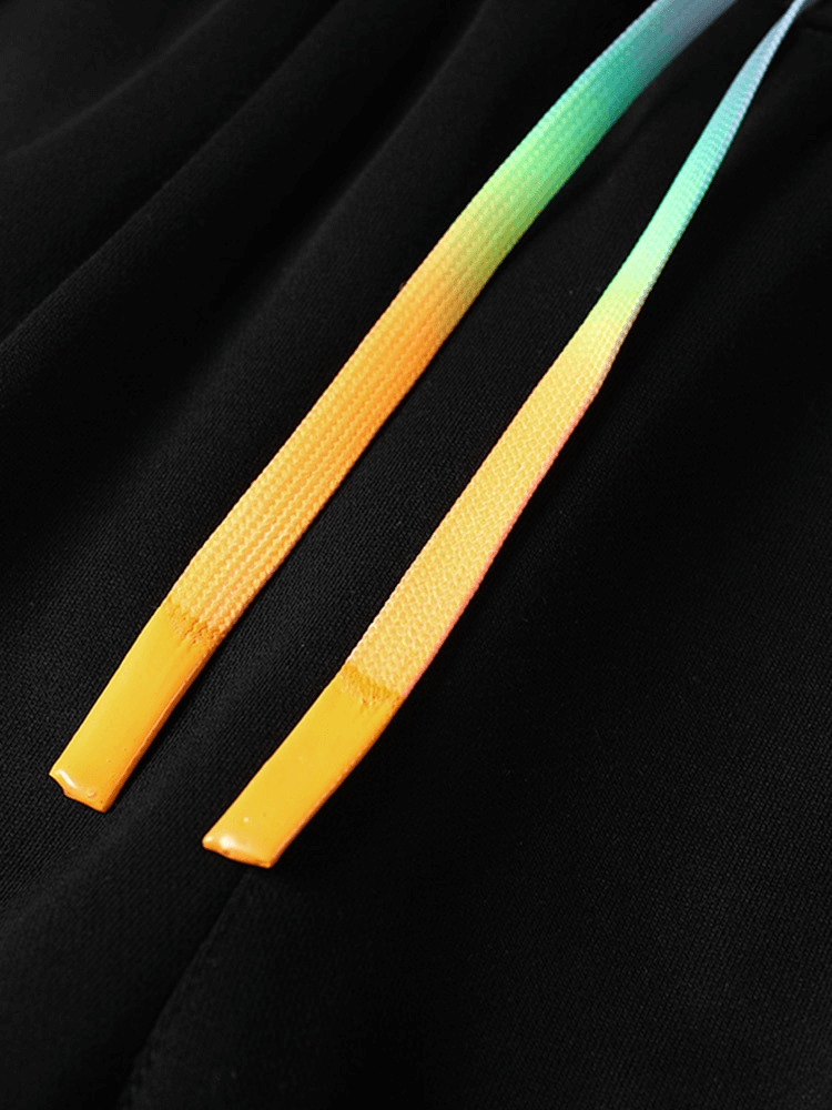 Close-up of colorful drawstrings on black sporty joggers for men, highlighting the design detail of SF1427 casual pants.