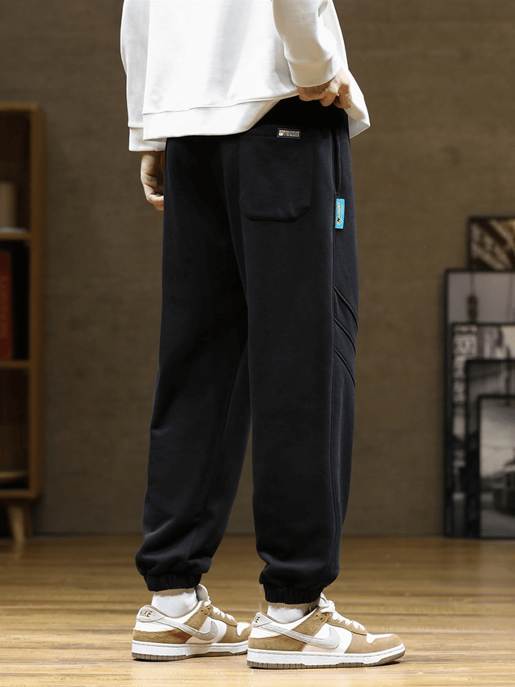 Sporty baggy casual joggers pants for men with side pockets, drawstring closure, loose fit, perfect for everyday wear.