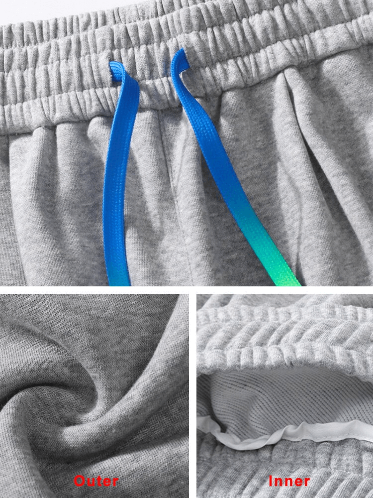 Close-up of grey men's joggers with blue drawstring and side pockets, showcasing outer and inner fabric details for style SF1427.