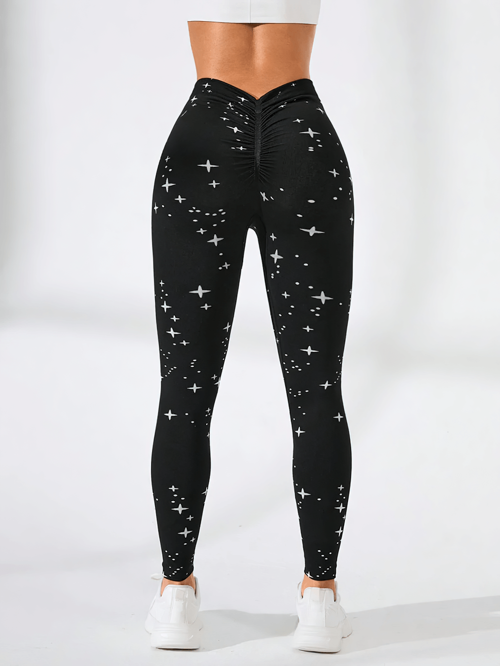 Woman wearing Starry Sky High Waist Push Up Gym Leggings - SF4003 with star print, showcasing stylish and squat proof fitness wear.