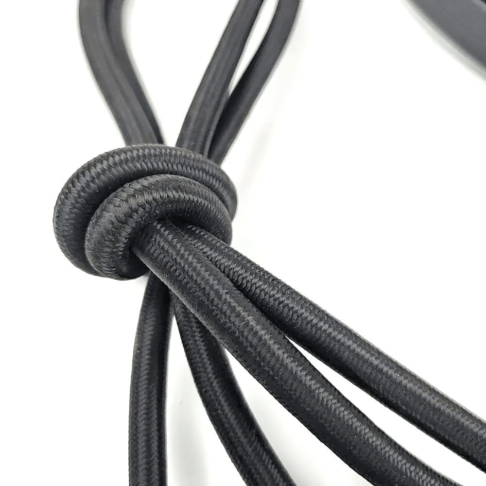 Close-up of black stepper resistance bands with durable elastic tubing for fitness training.