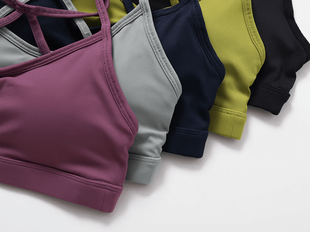 Collection of colorful strappy back sports bras showcasing seamless and stylish designs, ideal for fitness and casual wear.