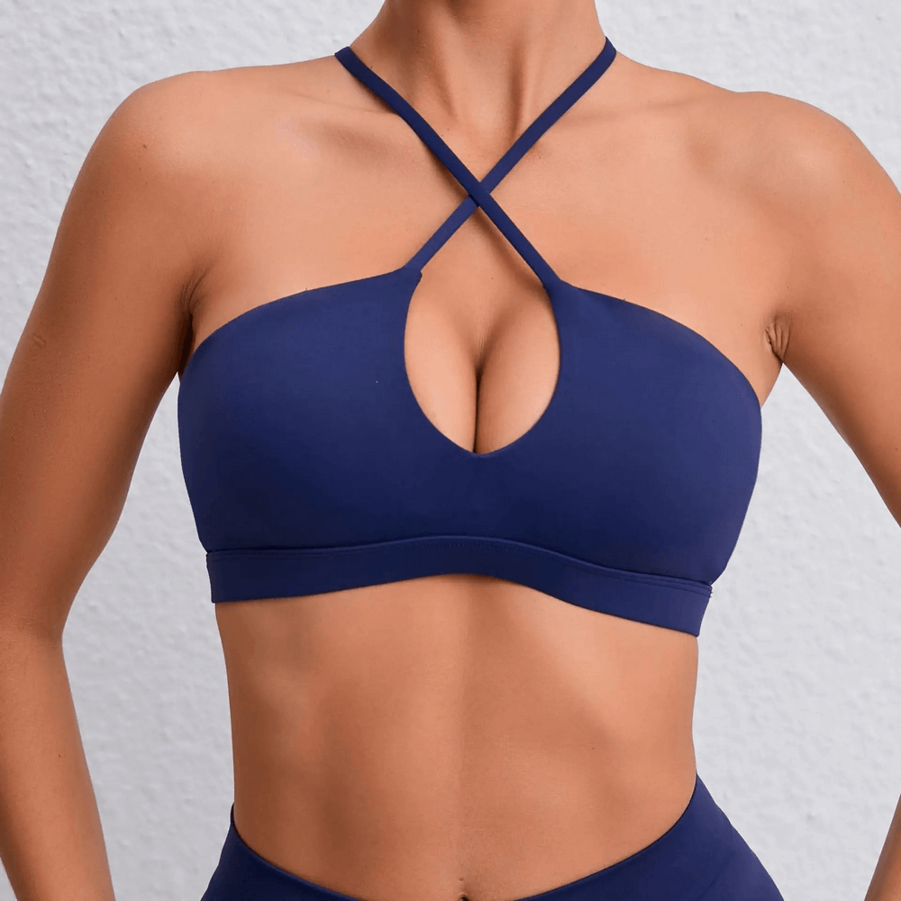Strappy crossback yoga bra in navy blue, perfect for fitness, running, and sports, made of breathable nylon and spandex for quick-dry comfort.
