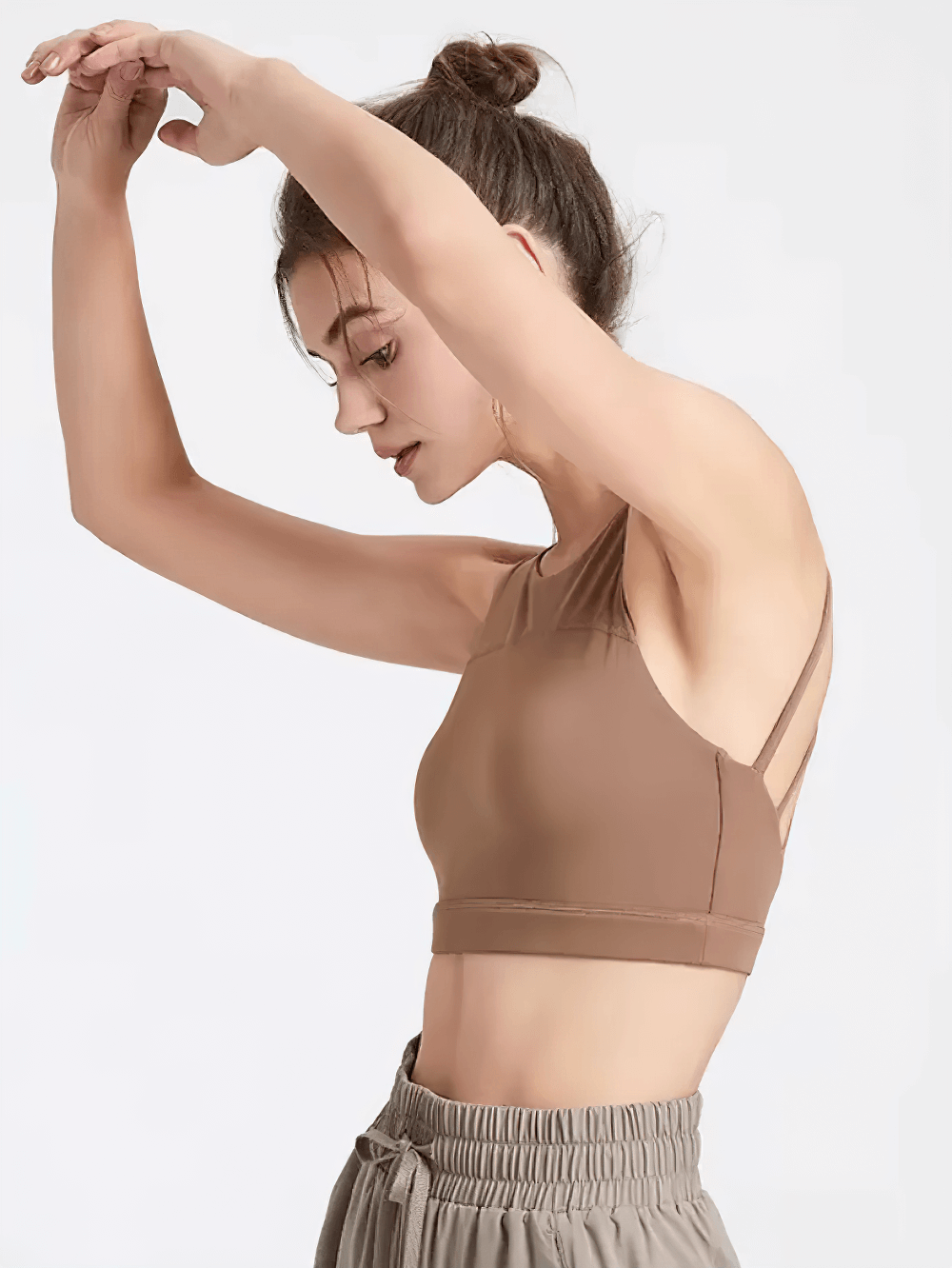 Model wearing Strappy Racerback Sports Bra for Gym Workouts - SF4041, featuring a stylish crisscross back design and moisture-wicking fabric.