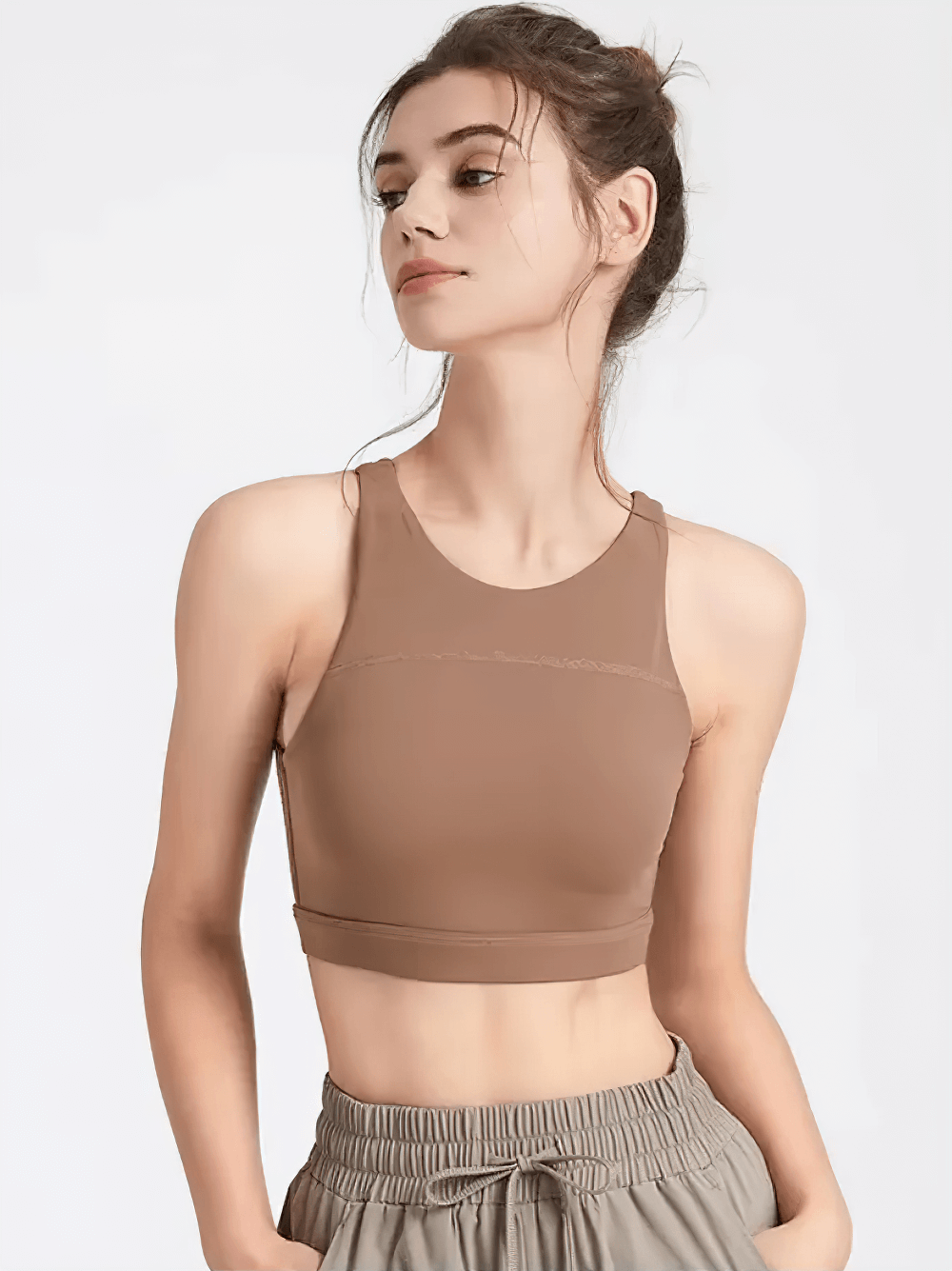 Woman wearing Strappy Racerback Sports Bra for Gym Workouts - SF4041, featuring a crisscross back design, ideal for yoga and gym sessions.