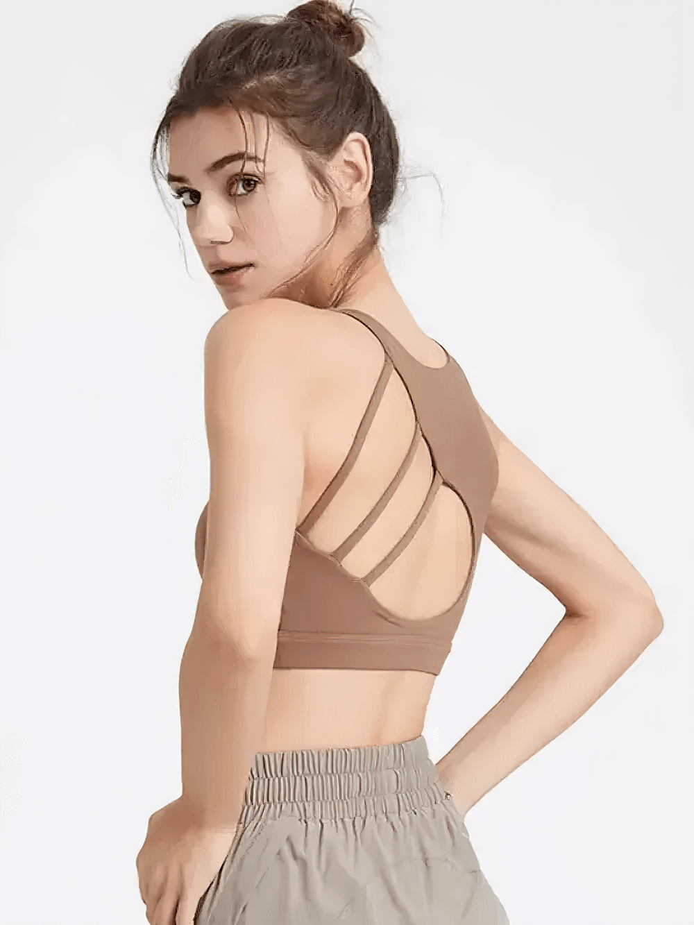 Woman wearing a Strappy Racerback Sports Bra for Gym Workouts - SF4041 with crisscross back design