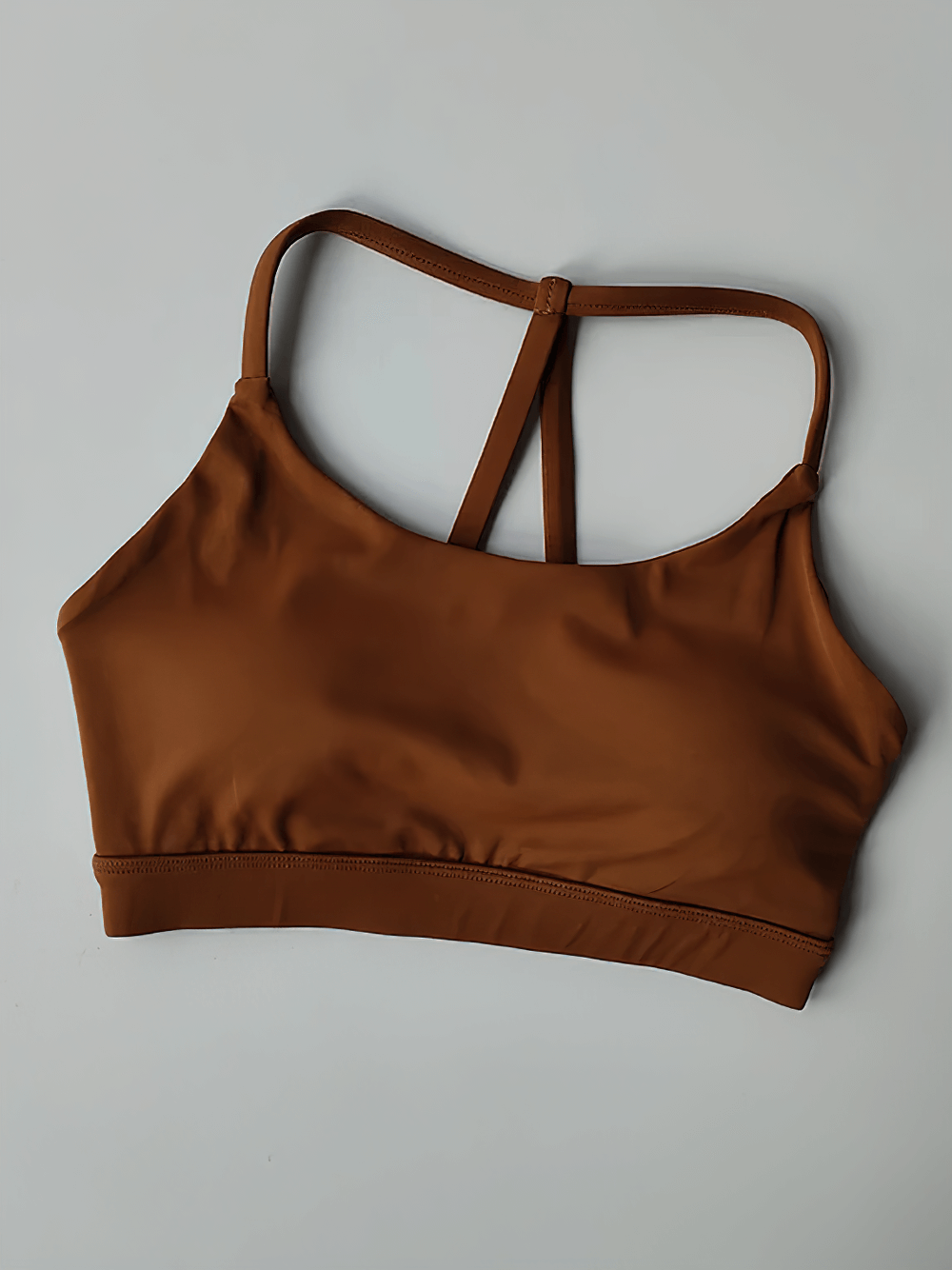 Rust-colored Strappy T-Back Push-Up Sports Bra for Yoga and Gym - SF4033 on a plain background