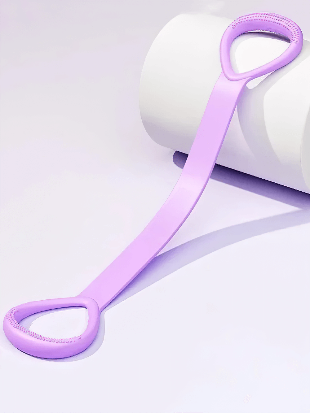 Purple stretch band for yoga and strength training with ergonomic handles, enhancing flexibility, posture, and muscle toning.