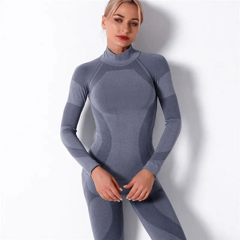 Woman wearing stretchy seamless long sleeves top for sport, breathable nylon fabric, perfect for yoga and fitness activities.