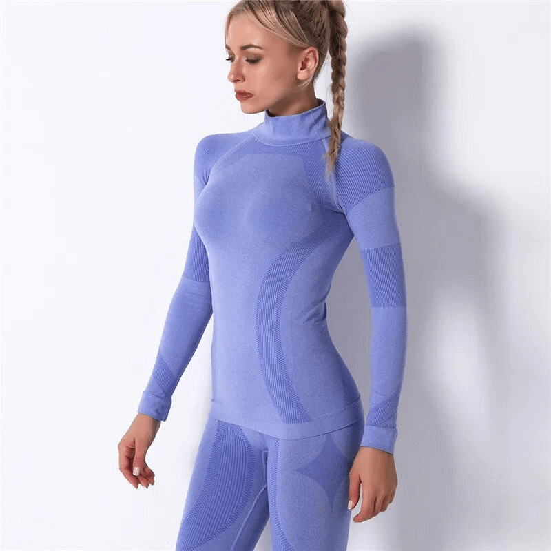 Woman wearing stretchy, seamless, super soft long sleeves sport top in light blue, perfect for yoga and fitness.