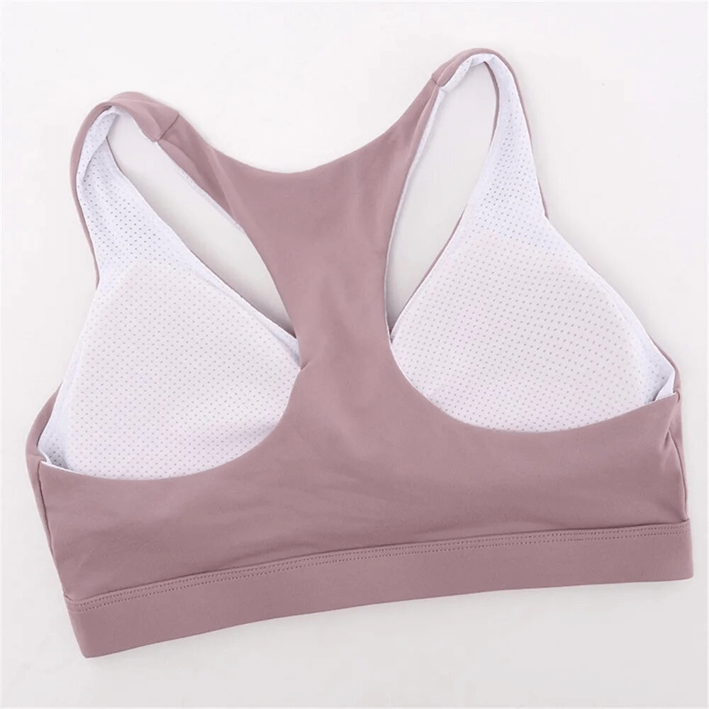Stylish breathable women's sports bra with woven front in mauve and white, perfect for yoga and running, made from lightweight nylon.