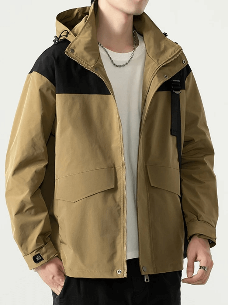 Man wearing a stylish casual men's hooded windbreaker with zipper, perfect for active lifestyle. Features a cozy hood and convenient pockets.