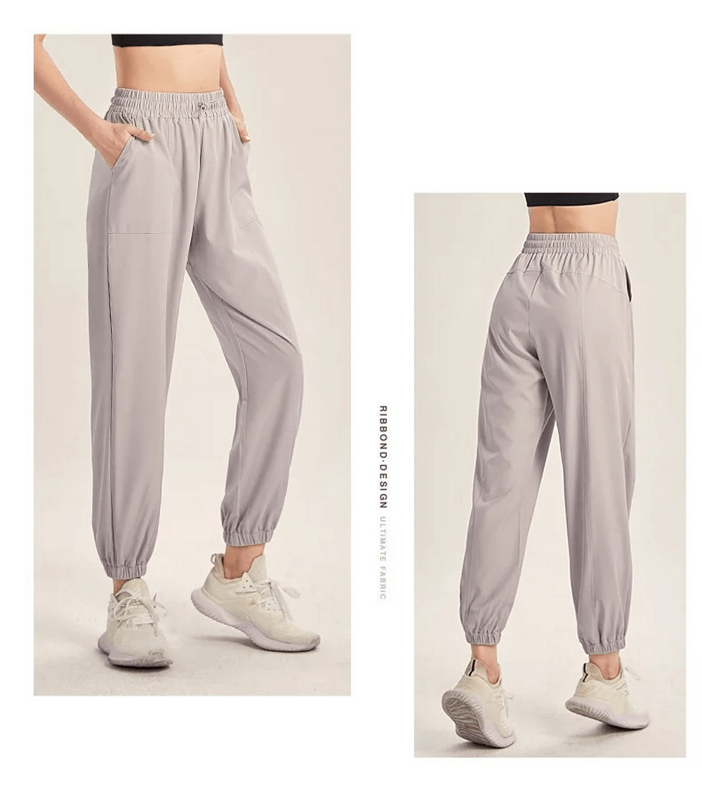 Women's stylish drawstring joggers in gray, perfect for yoga, gym, running, and dance. Durable athletic pants with adjustable fit.