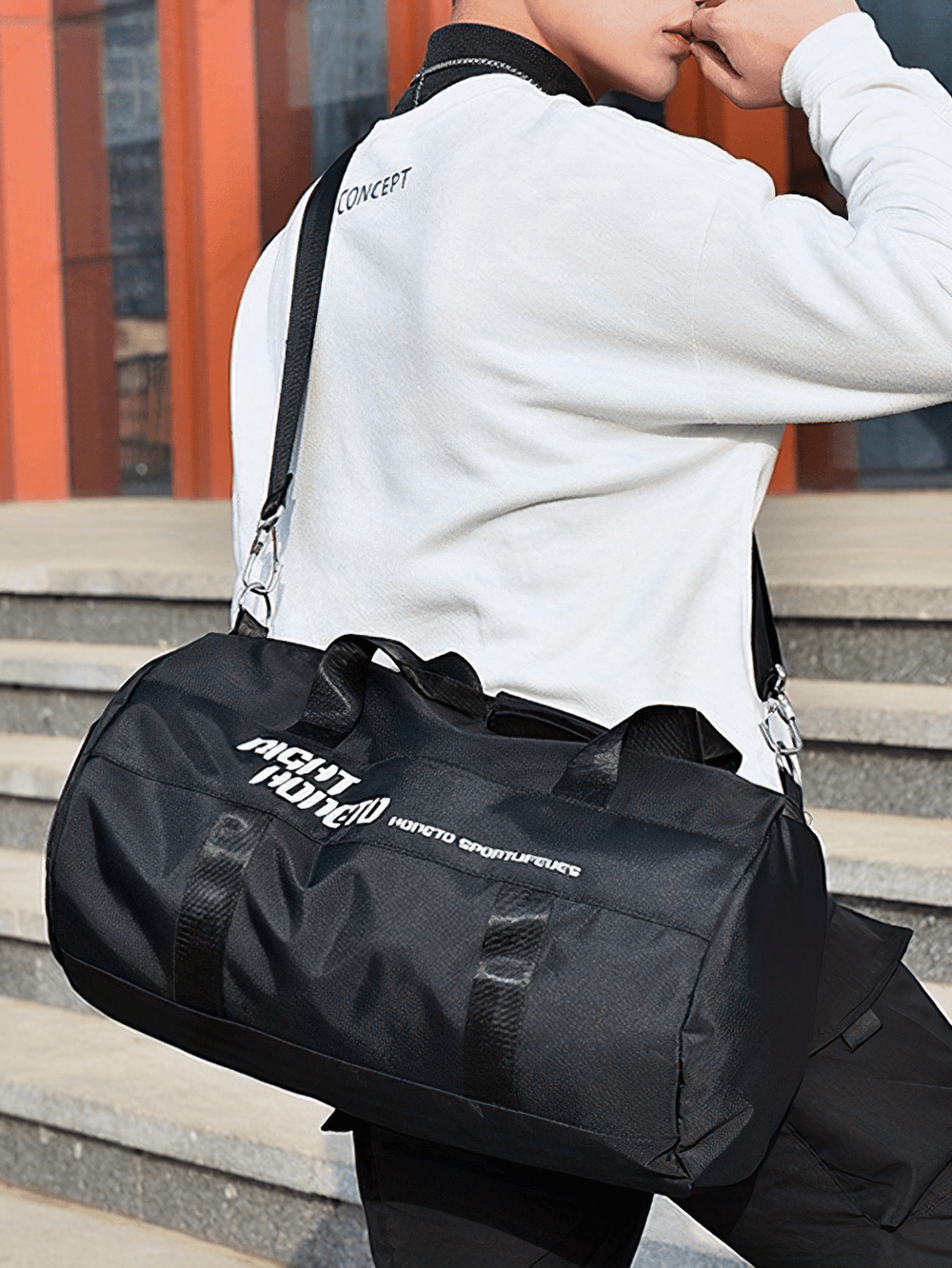 Stylish durable sports bag in black with zippered closure, perfect for gym and travel. Lightweight design with detachable shoulder strap.