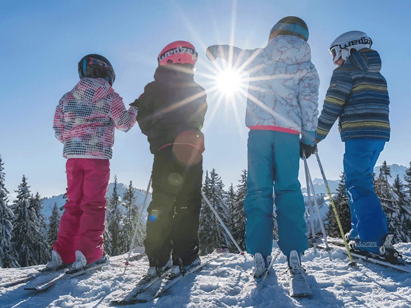 Kids skiing on a sunny day in vibrant, colorful jackets; outdoor winter fun and adventure. Stylish Durable Warm Ski Jacket for Girls - SF3582.