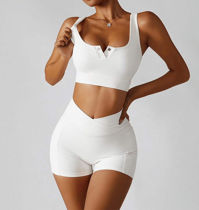 Woman wearing stylish elastic short women's shorts with side pockets in white, perfect for yoga, breathable and quick-drying.