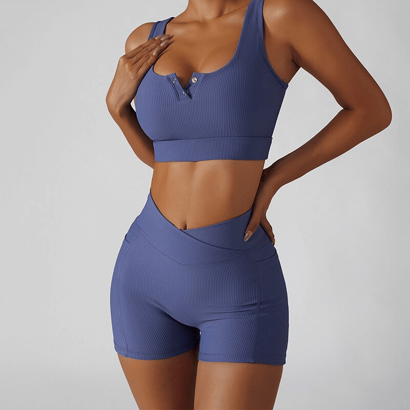 Stylish women's short shorts with elastic waist, side pockets, shown in a sporty purple design, perfect for yoga and activewear.