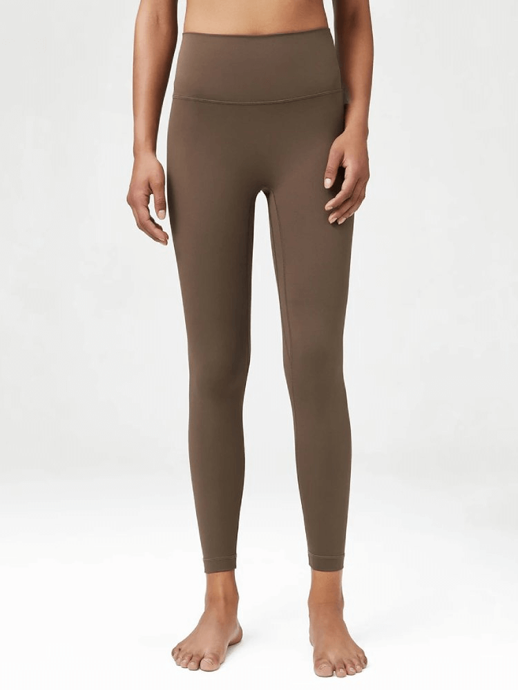 Women's high-waist LYCRA yoga leggings in brown, featuring an elastic waist for a comfortable fit. Ideal for yoga, gym, or casual wear.
