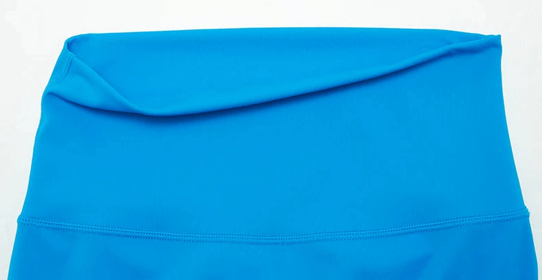 Bright blue high-waist yoga leggings with elastic waistband, perfect for active women seeking comfort and style.