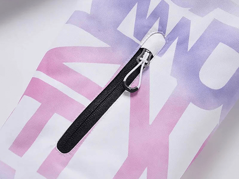 Letter printed ski jacket sleeve detail with zippered pocket in pink and white, showcasing durable fabric and sleek design.