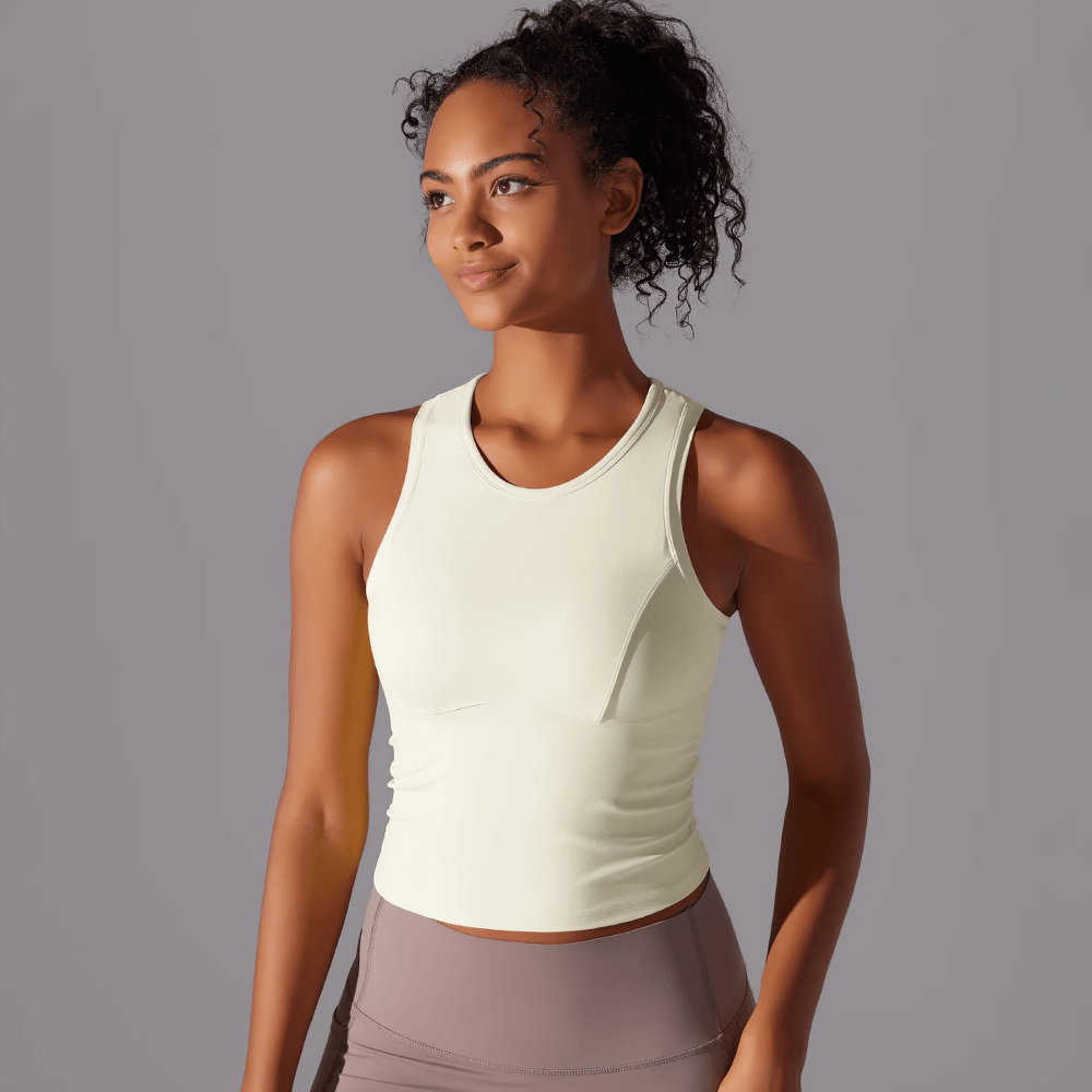 Stylish high-impact sports tank top for women, perfect for yoga and intense workouts, in soft yellow.