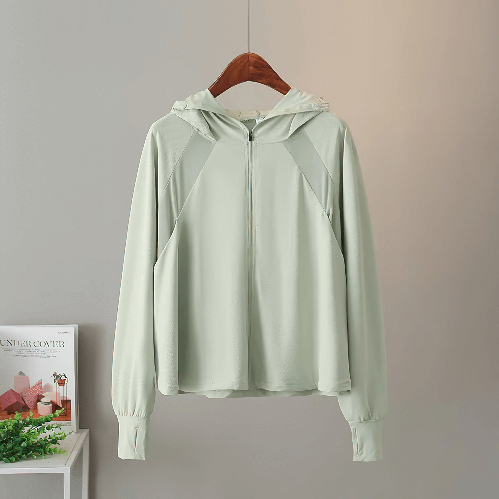 Mint green hooded jacket on hanger, featuring a full zipper and lightweight design. Offers UPF 50+ UV protection and casual style.